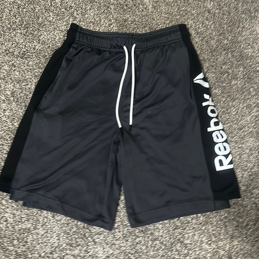 Brand: Reebok  Color: Black and Grey  Size: Boys 16